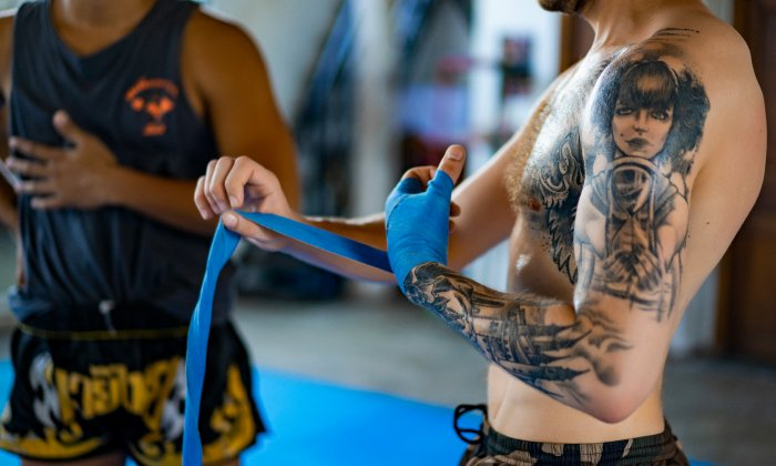 สาเหตุที่ควรหยุดออกกำลังกายหลังสัก